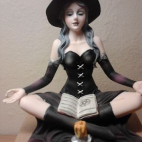 witch sat down statue